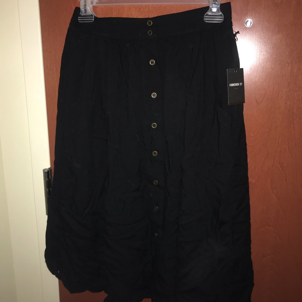 Mid length black button up skirt